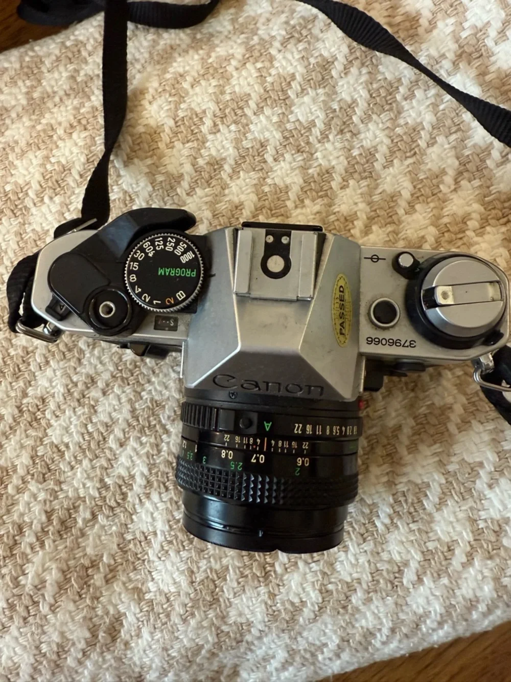 Canon AE-1 Film SLR Camera in Silver and Black with Lens